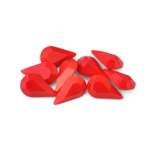 Pear shaped faceted Austrian crystal rhinestones in the color Cherry Red displayed on a white background. 