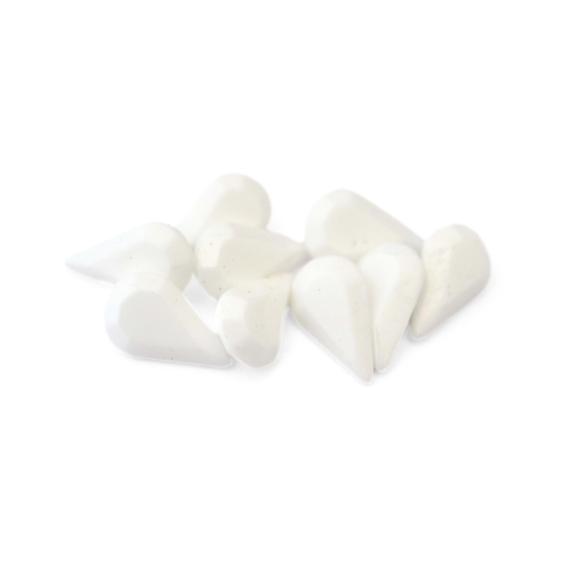 Pear shaped faceted Austrian crystal rhinestones in the color Chalk White displayed on a white background. 