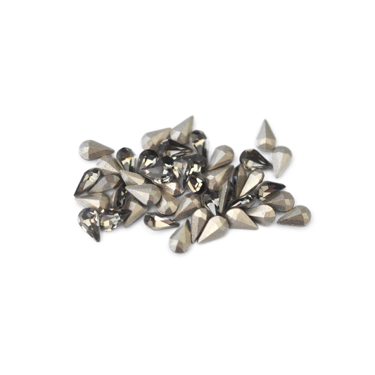 Pear shaped faceted Austrian crystal rhinestones in the color Black Diamond displayed on a white background. 