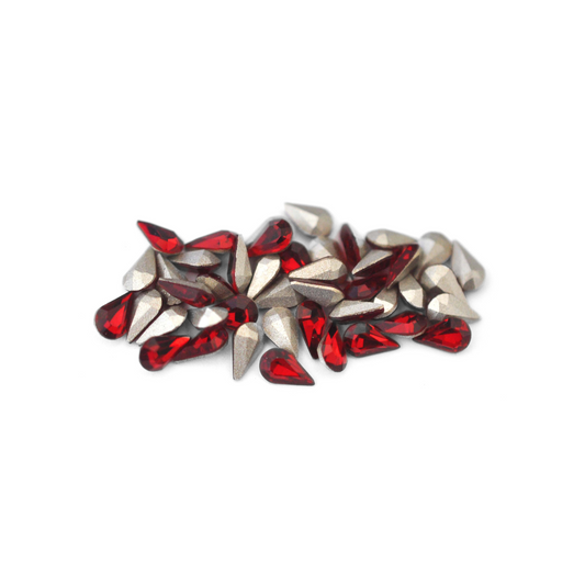 Pear shaped faceted Austrian crystal rhinestones in the color Siam displayed on a white background. 