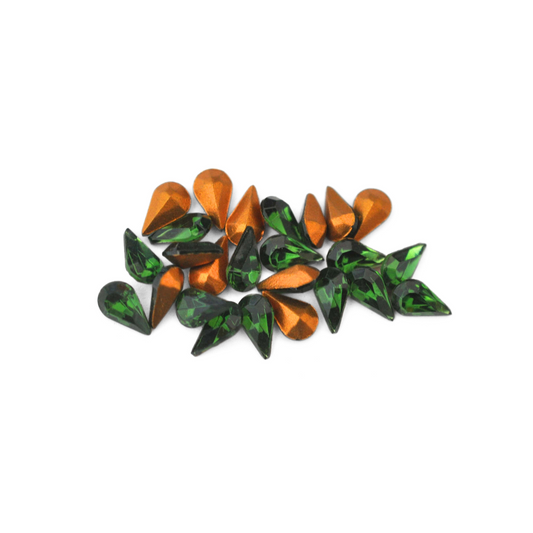 Pear shaped faceted Austrian crystal rhinestones in the color Green Turmaline displayed on a white background. 