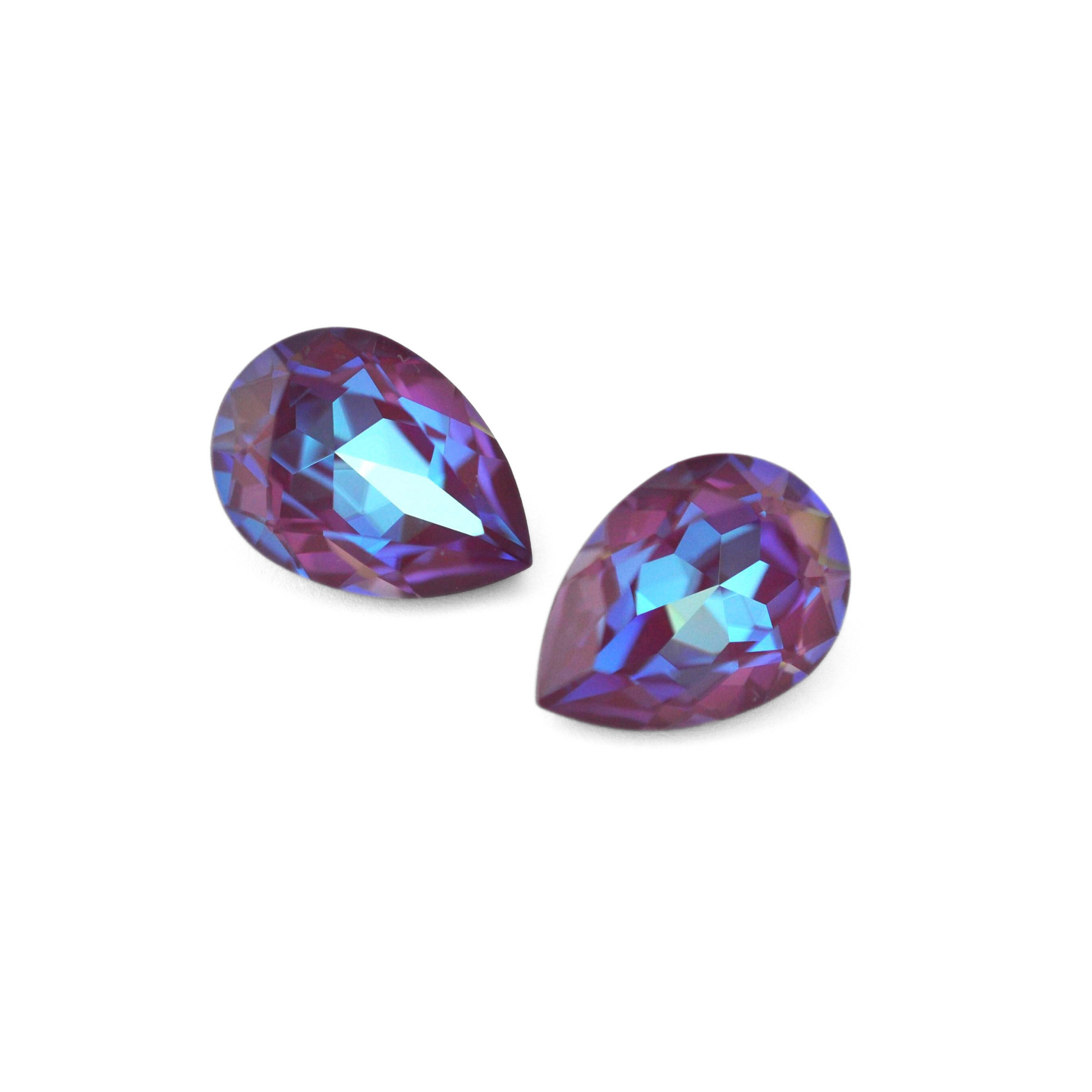 Pear shape faceted Austrian crystal rhinestones in the color Burgundy Delite displayed on a white background.