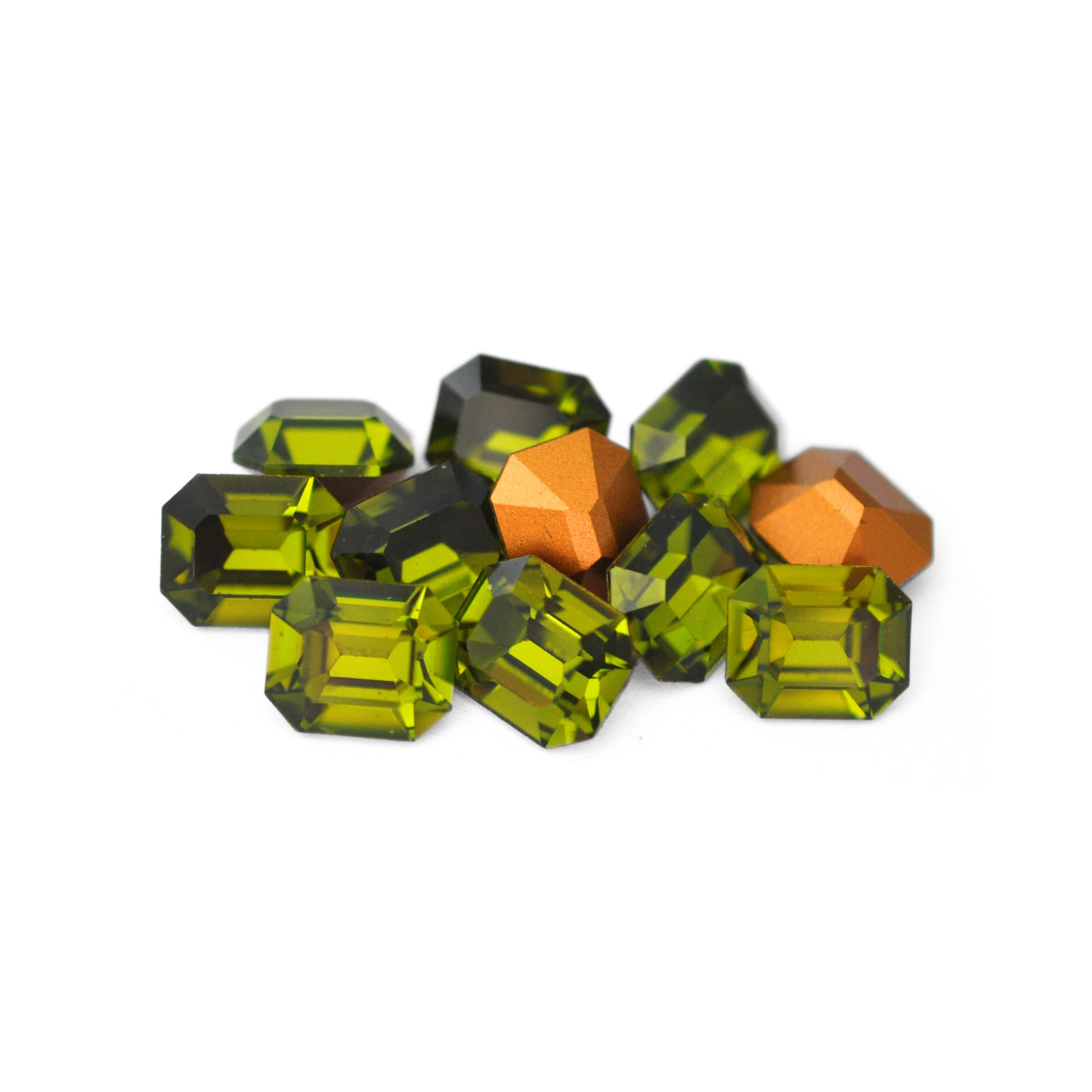Octagon shaped faceted Austrian crystal rhinestones in the color Olivine displayed on a white background. 