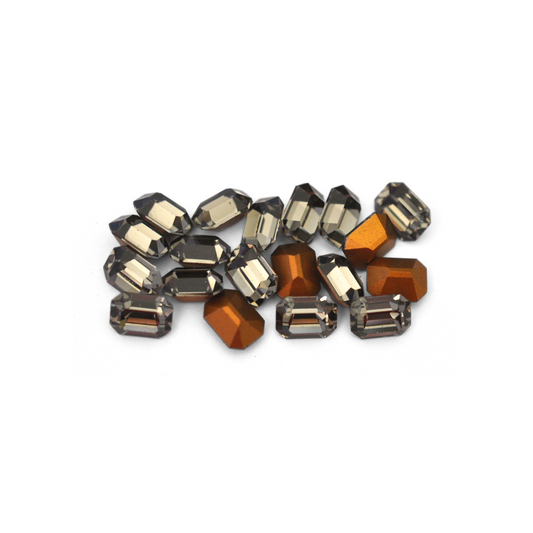 Octagon shaped faceted Austrian crystal rhinestones in the color Black Diamond displayed on a white background. 