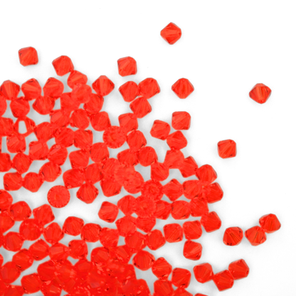 Austrian crystal 5328 bicone beads in the color Hyacinth spilling out onto a white background. 