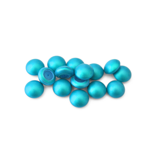 Round Austrian Crystal Glass Pearl Cabochons in the color Iridescent Dark Turquoise displayed on a white background