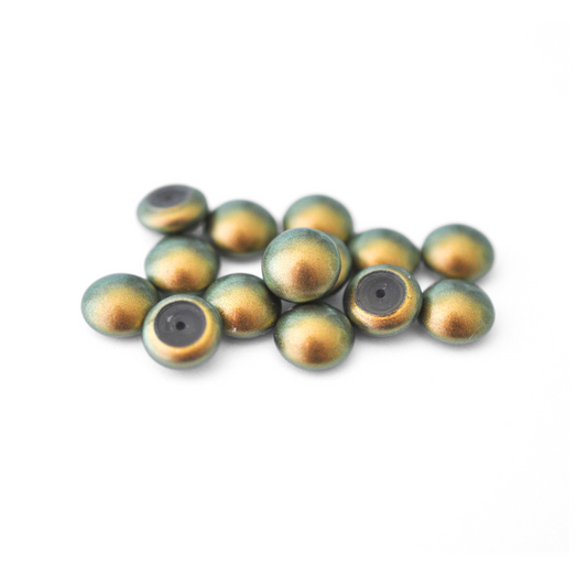 Round Austrian Crystal Glass Pearl Cabochons in the color Iridescent Green displayed on a white background