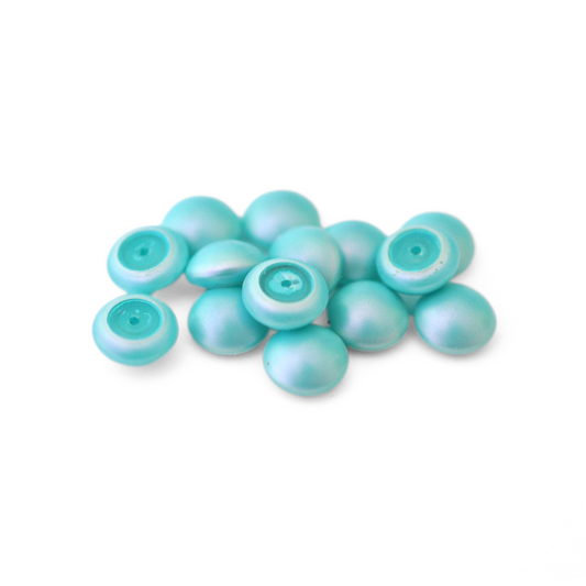 Round Austrian Crystal Glass Pearl Cabochons in the color Iridescent Light Turquoise displayed on a white background
