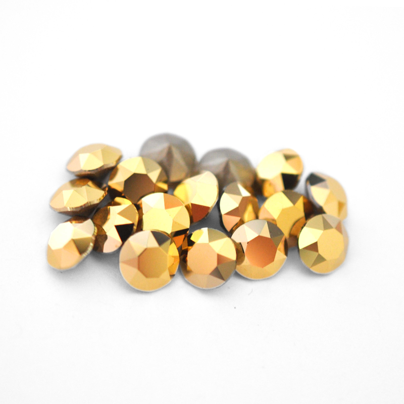 Round faceted Austrian crystal rhinestones in the color Aurum displayed on a white background