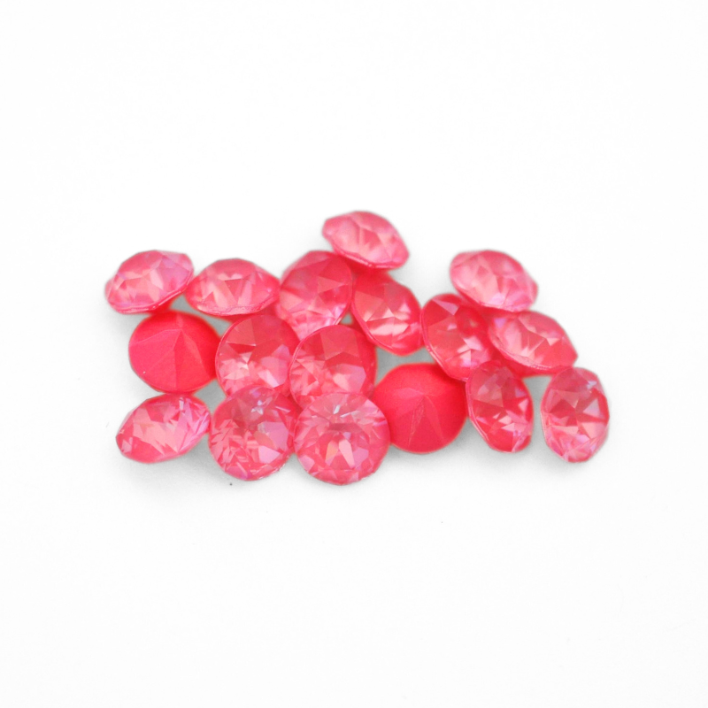 Round faceted Austrian crystal rhinestones in the color Dahlia Ignite displayed on a white background