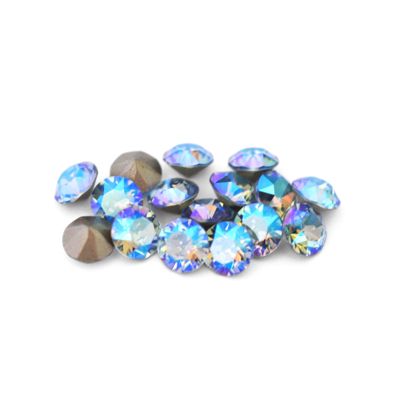 Round faceted Austrian crystal rhinestones in the color Light Sapphire Shimmer displayed on a white background