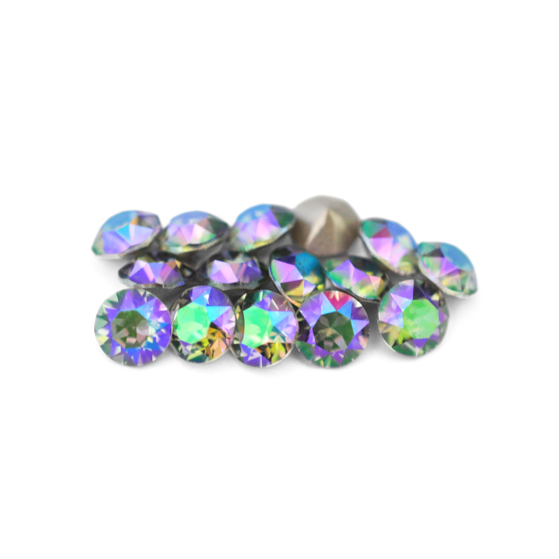 Round faceted Austrian crystal rhinestones in the color Paradise Shine displayed on a white background