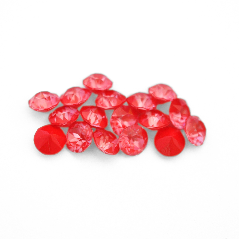 Round faceted Austrian crystal rhinestones in the color Poppy Red Ignite displayed on a white background