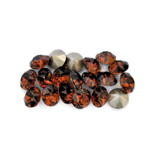 Round faceted Austrian crystal rhinestones in the color Smoked Topaz displayed on a white background