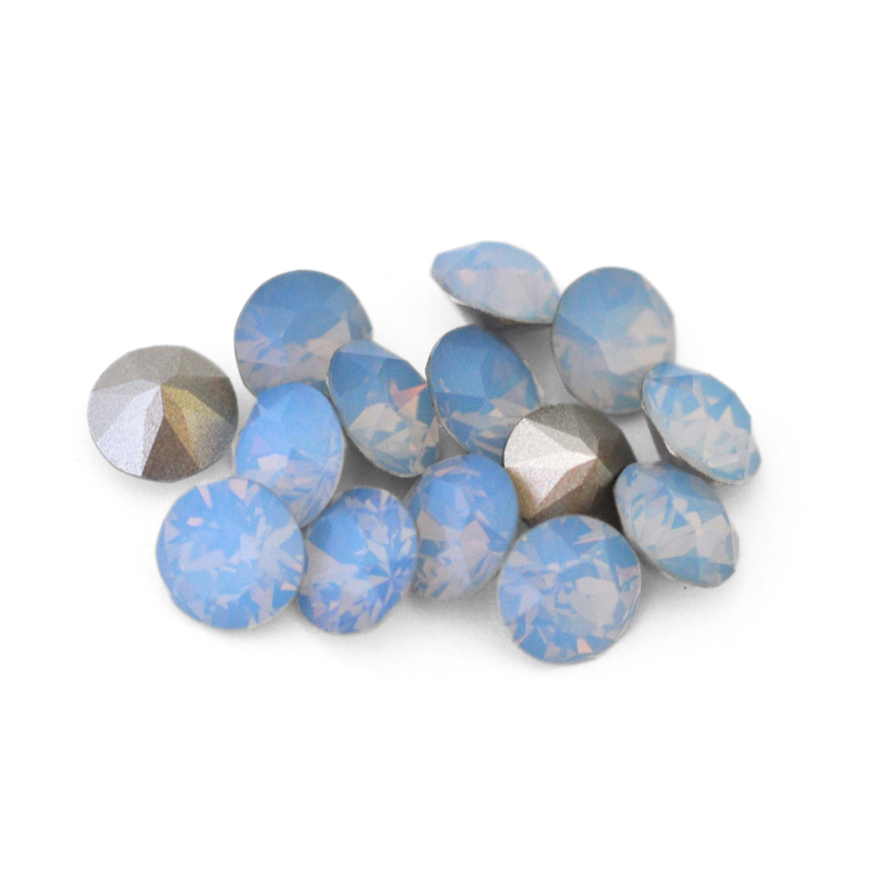 Round faceted Austrian crystal rhinestones in the color Air Blue Opal displayed on a white background.