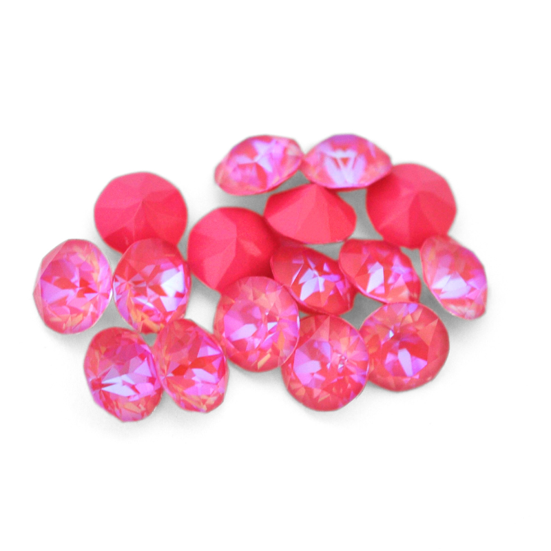 Round faceted Austrian crystal rhinestones in the color Lotus Pink Delite displayed on a white background.
