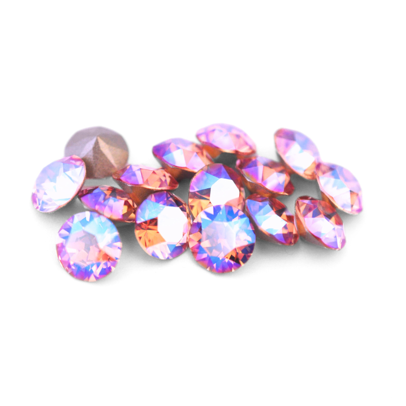 Round faceted Austrian crystal rhinestones in the color Light Rose Shimmer displayed on a white background.