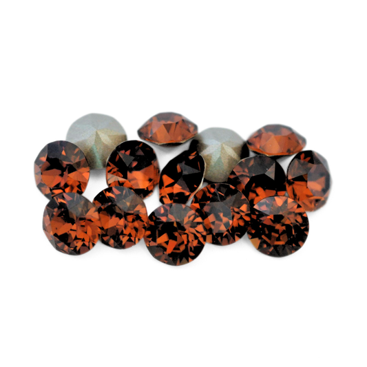 Round faceted Austrian crystal rhinestones in the color Smoked Topaz displayed on a white background