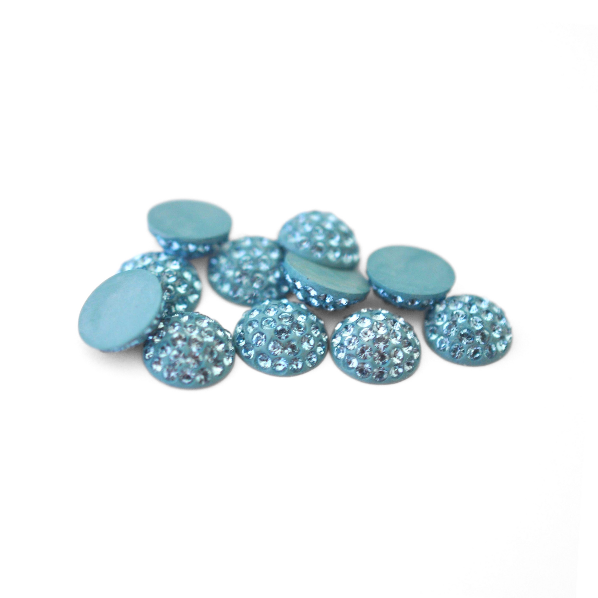 Round Pave Cabochons with Austrian crystal rhinestones in the color Aquamarine displayed on a white background
