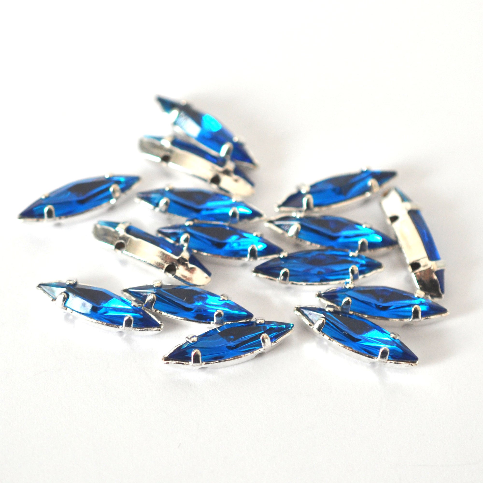 Capri Blue 15x4mm Navette Sew On Crystals - 12 Pieces